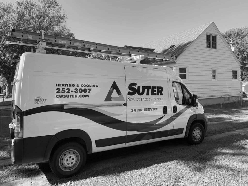 The CW Suter truck is shown in the driveway of a home