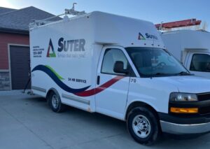 CW Suter van parked in front of a customer's house to check why their furnace is blowing cold air