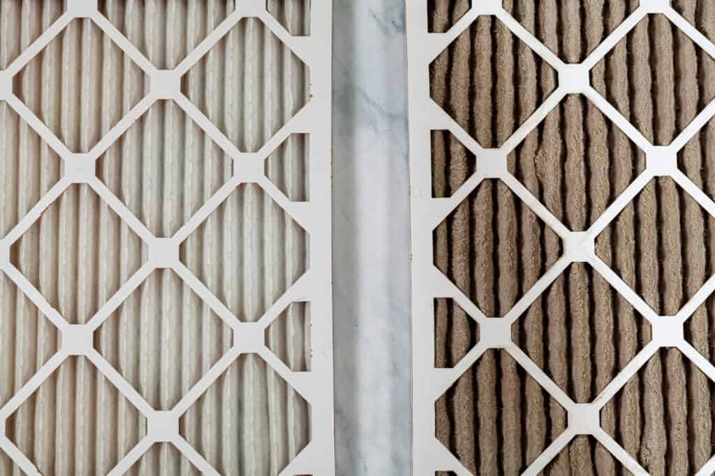 side by side view of a clean air filter and a dirty air filter which may be causing air conditioner to not blow cold air