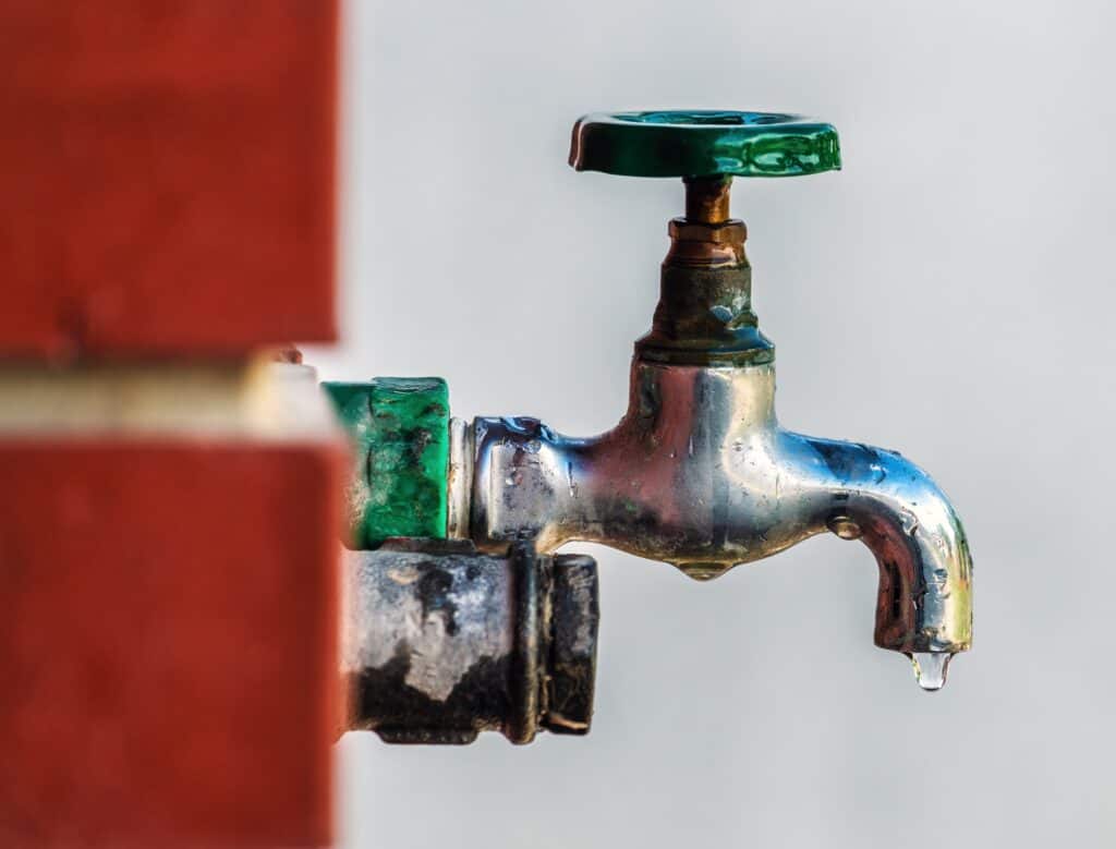 Water,Supply,,Outdoor,Garden,Faucet,With,Green,Handle,,Selective,Focus